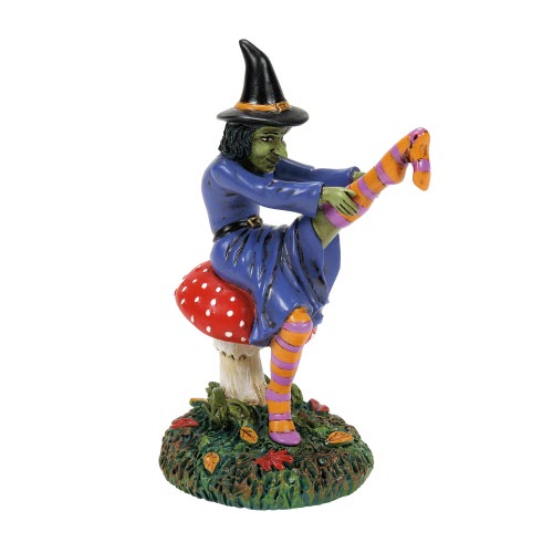 Witch with stocking on mushroom seat