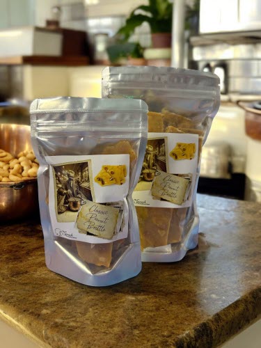 Peanut Brittle bags on counter with peanuts